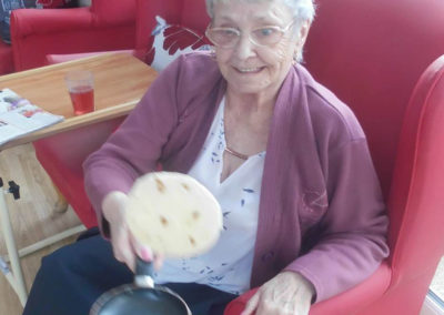 Residents flipping pancakes at Woodstock Residential Care Home 5