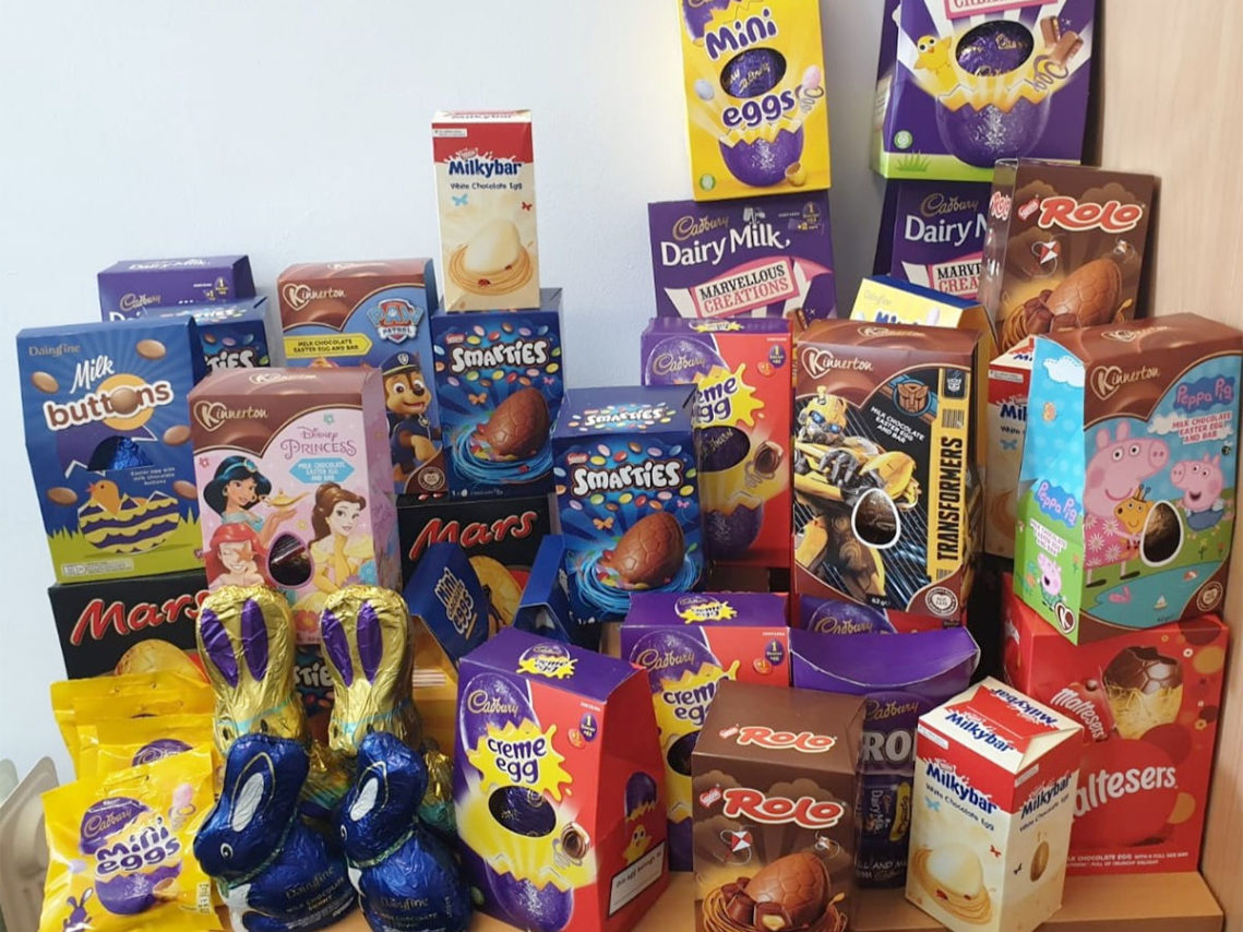 A table stacked full of Easter eggs to be delivered to the Hospice