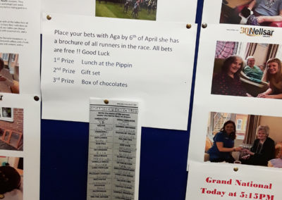 A notice board detailing Grand National horses and prizes for winning