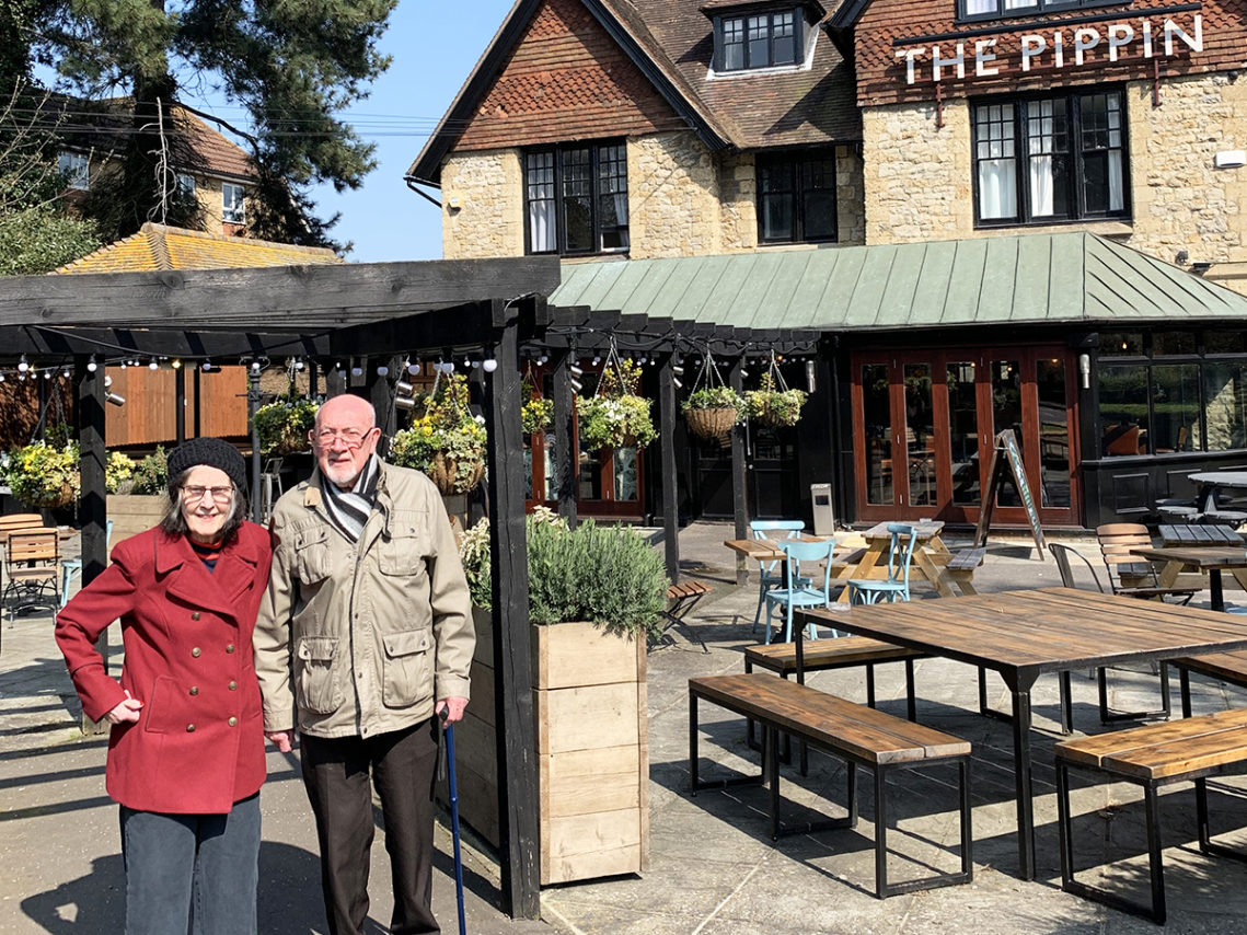 Resident and her husband standing outside the Pippin pub