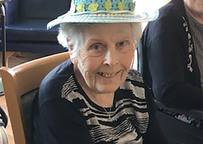 Lady resident at Silverpoint Court Residential Care Home wearing an Easter bonnet 4