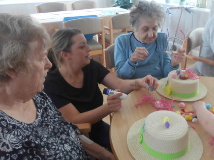 Residents making Easter bonnets at Woodstock Residential Care Home