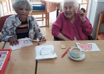 Woodstock ladies doing an arts and crafts activity together having a cup of tea