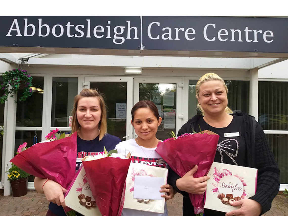 Nurses from Abbotsleigh Care Home with flower and chocolate gifts on International Nursing Day