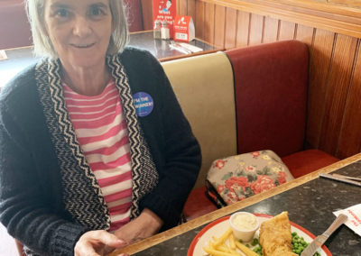 Female residents eating fish and chips at Frankie and Benny's