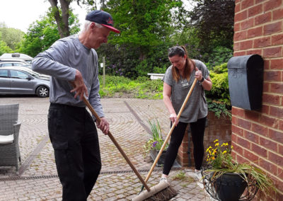 Sweeping the entrance at Abbotsleigh Care Home