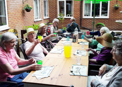 Residents at Lulworth House Residential Care Home having lunch outside