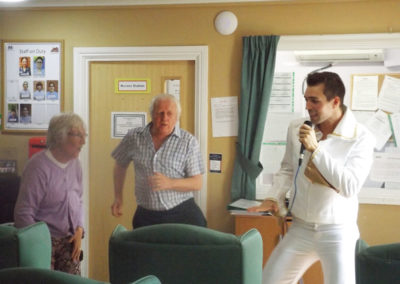 An Elvis impersonator with residents at Princess Christian Care Home