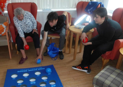 Volunteers playing ball target with a resident at Woodstock Residential Care Home