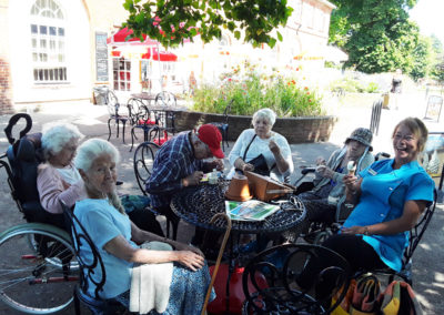 Group of residents sitting together in the park