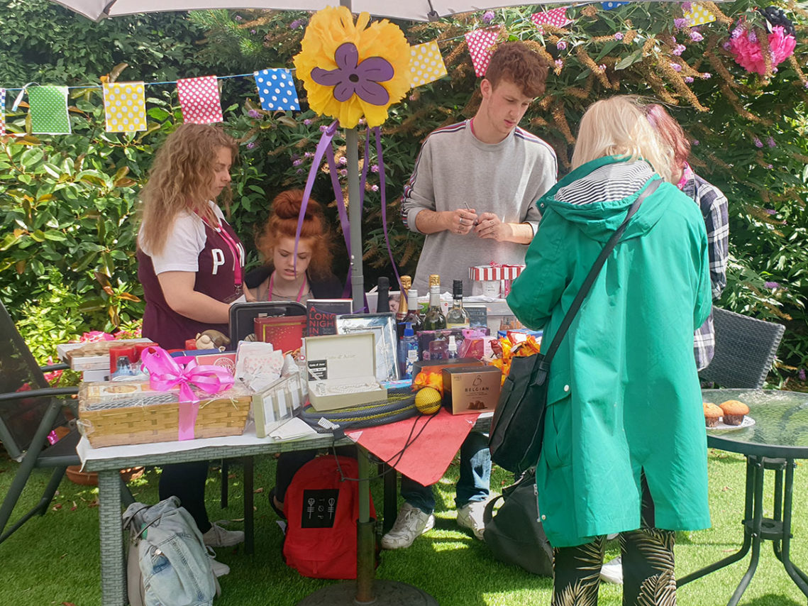 A stall outside at Lukestone Care Home during their summer fete