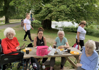 Lulworth residents and staff enjoying a picnic in the grounds of Leeds Castle
