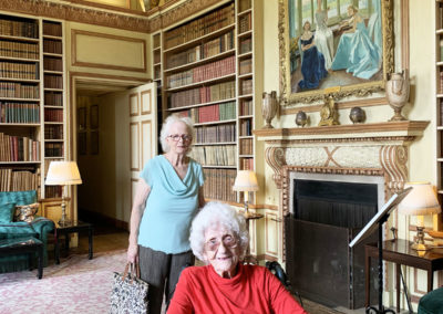 Two lady residents looking at a room inside Leeds Castle