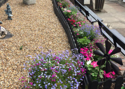 Meyer House Care Home garden with freshly planted flowers 3