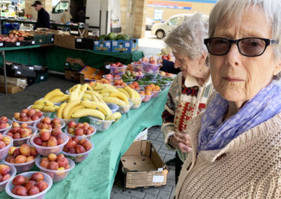 Lady residents looking at fruit and veg at Maidstone market