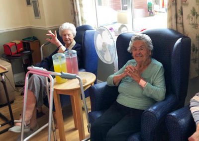 Lady residents at Silverpoint enjoying some live music in their lounge
