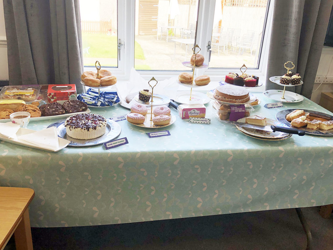 A table of cakes and sweet treats at Sonya Lodge