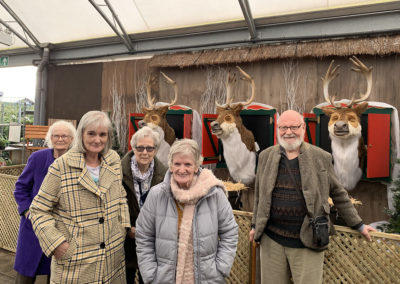 Lulworth residents at Notcutts Garden Centre by the reindeer