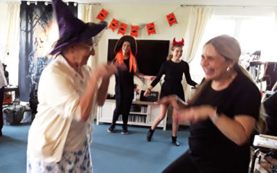 Residents being entertained by Halloween dancers