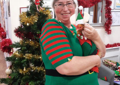 Staff member and the Loose Valley chicken dressed as elves