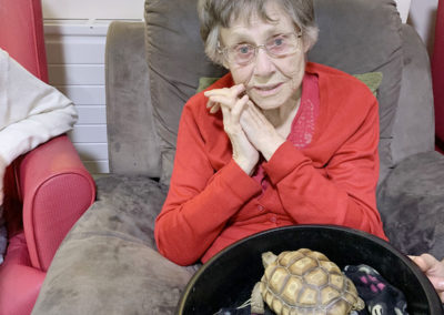 Lulworth House resident with a tortoise