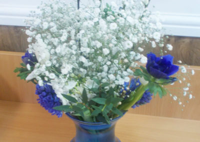 A vase filled with purple and white flowers
