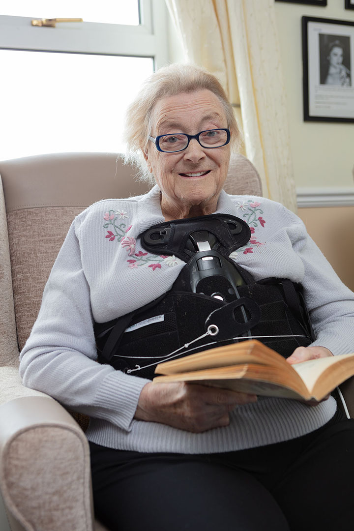 One of our ladies reading in the Lounge at Silverpoint Court