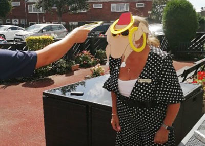 Manager Gill at Meyer House Care Home playing chicken hoopla!