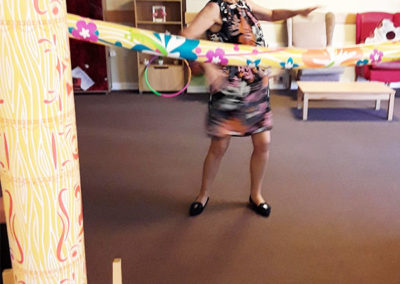 Manager Neli at Hengist Field Care Home trying out the limbo!
