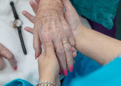 Princess Christian residents enjoying being pampered with a hand and face massage