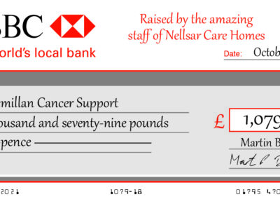 Nellsar fundraising cheque for Macmillan Cancer Support