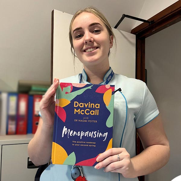 Nellsar staff with McCall's Menopausing Book